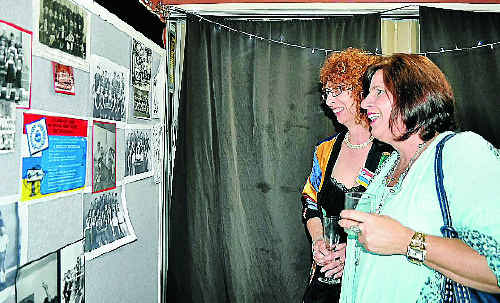 Helen Heijnen and Cathi Kelly look at old school photos. Helen Heijnen and Cathi Kelly look at old school photos.